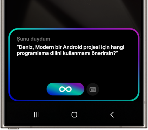 Samsung Galaxy S24 Ultra üzerinde yapay zeka uygulamasının konuşma arayüzünü gösteren 2. ekran görüntüsü. Ekranın ortasında 'Şunu duydum' başlığı altında 'Deniz, Modern bir Android projesi için hangi programlama dilini kullanmamı önerirsin?' sorusu yer almaktadır.